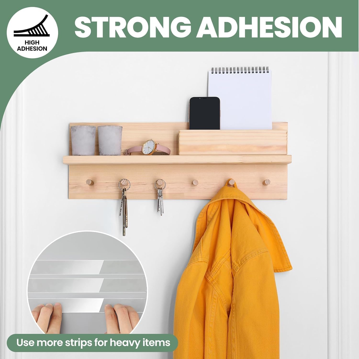 Wooden wall-mounted rack with hooks and shelves, featuring a yellow jacket and phone on a white background.